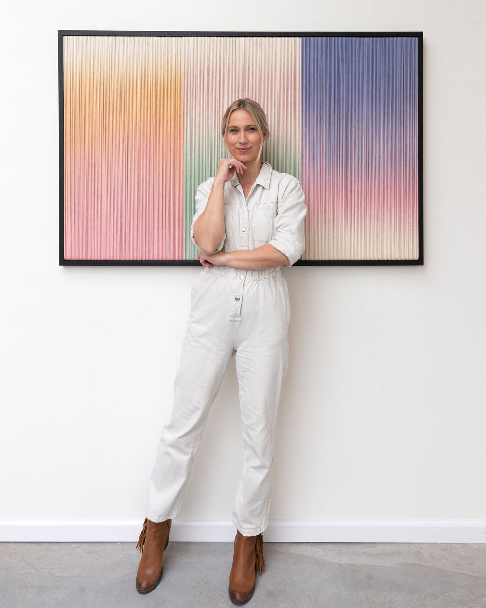 Dawnfield fiber artwork, colorful with artist Rianne Aarts standing in front